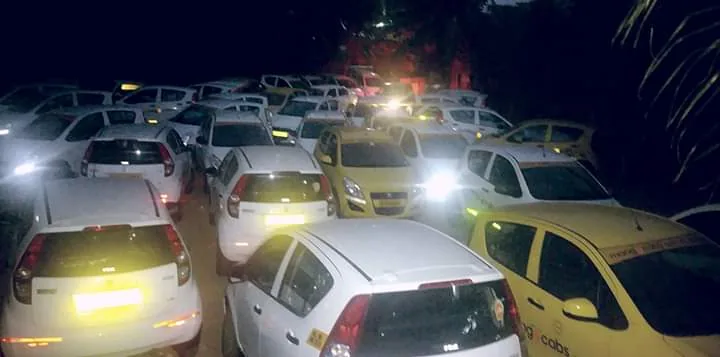 Mango Cabs yard — fleet at night